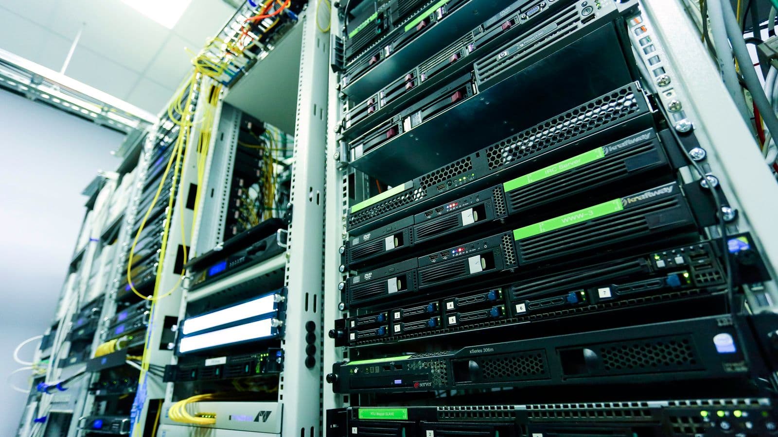 Enterprise server racks in a data centre corridor, representing the infrastructure an enterprise mcp rollout has to be governed against