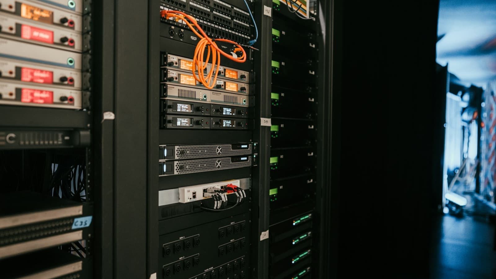 A rack of servers in a server room, standing in for the self hosted agent memory infrastructure that needs backup, monitoring and re-indexing once it is running real traffic